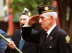 Dalpha Lavallee salutes outside New Bedford city hall.